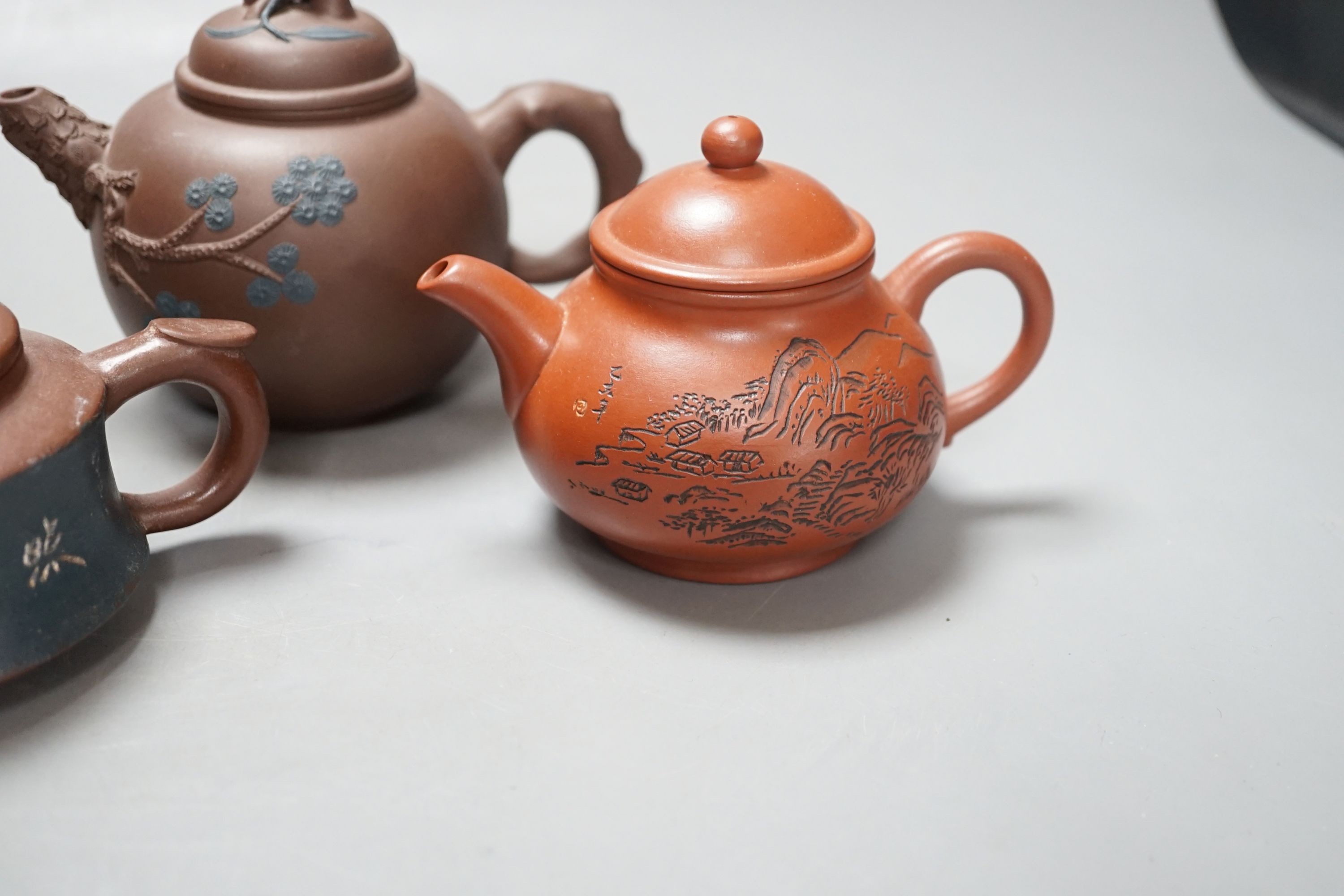 A group of four Yixing pottery teapots - tallest 11cm